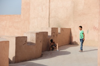 Boys play amid Kashgar's alleyways.